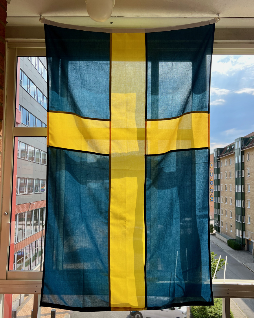 A Swedish flag in my balcony window.