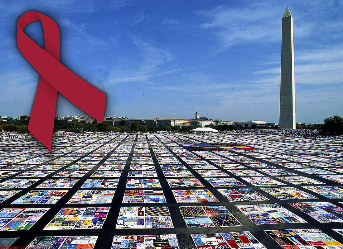 A photo of AIDS quilts and a red ribbon.
