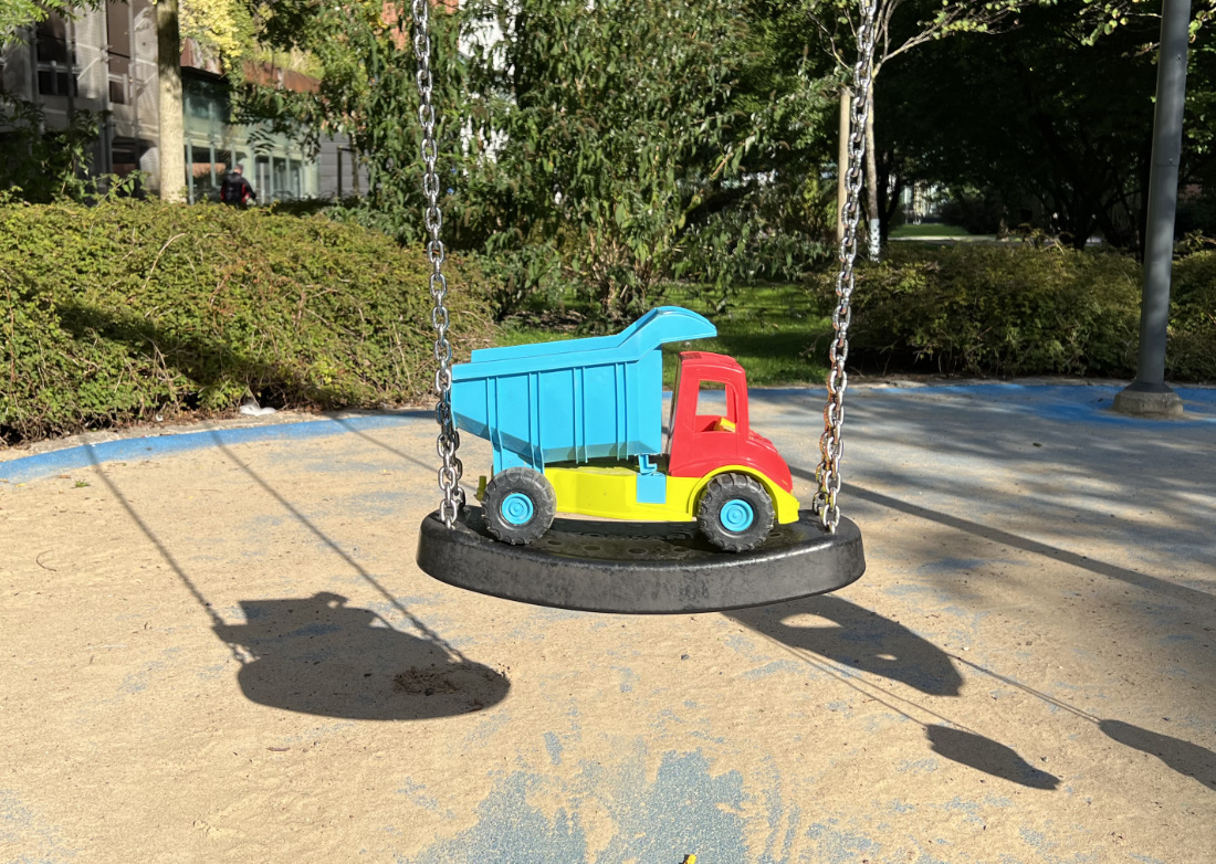 Children playground with a plastic lorry.